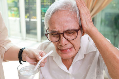 Close-up of woman drinking glass