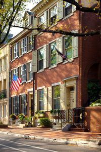 Street amidst houses and buildings in city