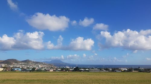 Scenic view of sea and buildings against sky