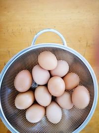 High angle view of eggs in container on table