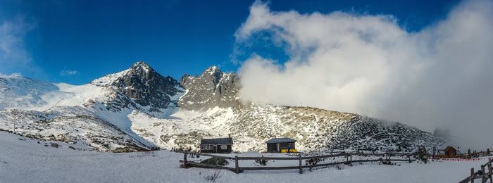 Scenic view of snowcapped mountains against sky