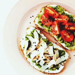 High angle view of food in plate on white background