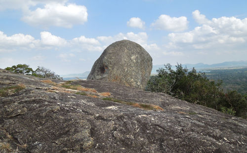 Rock formations on landscape against sky