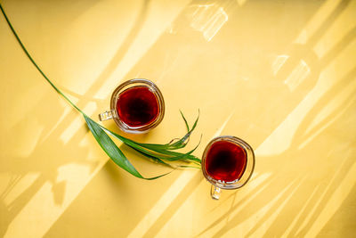 High angle view of red wine glass on table