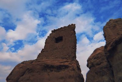 Low angle view of old ruin building against sky