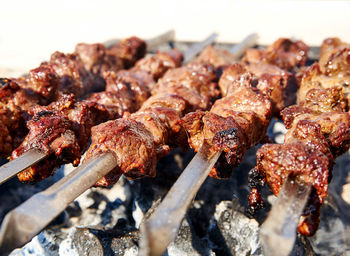 Close-up of meat on barbecue grill