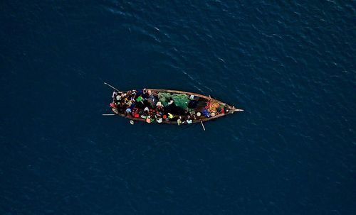 Directly above shot of people in boat on sea