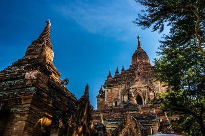 Low angle view of old buddhist temples against sky