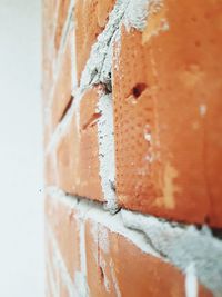 Close-up of orange paint on wall