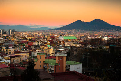 High angle shot of townscape against sky at sunset