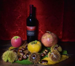 Various fruits in bottle on table