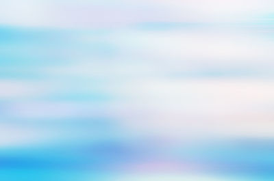 Defocused image of blue sea against sky