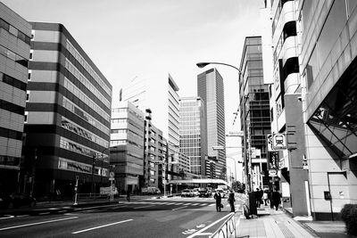 People walking on road in city