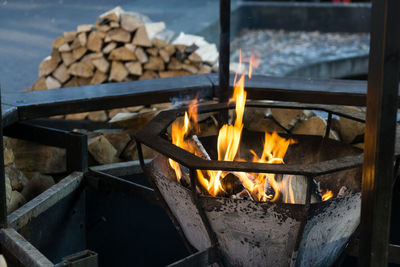 Close-up of illuminated fire pit at sunset