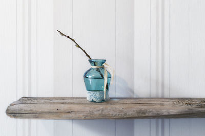 Close-up of glass bottle on table at home