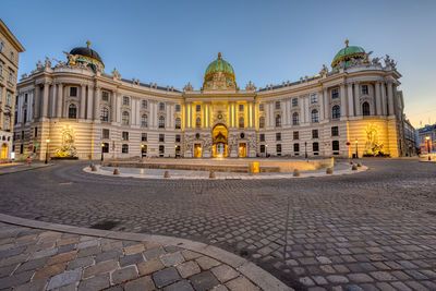 The famous hofburg and st michaels square in vienna at twilight