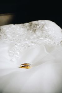 High angle view of wedding rings on white background
