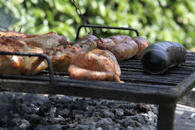 Close-up of meat on barbecue grill