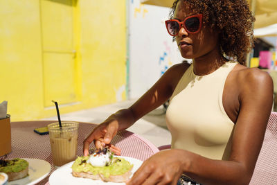 Woman sitting in the outdoor cafe