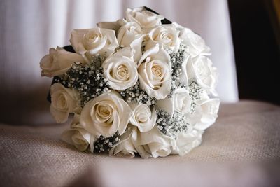 Close-up of white roses on table