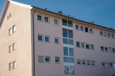 Low angle view of building against blue sky