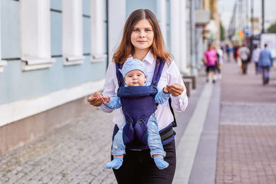 Portrait of mother and daughter outdoors