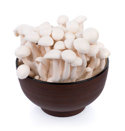 Close-up of eggs in bowl against white background