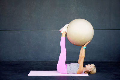 Midsection of woman with balloons on table