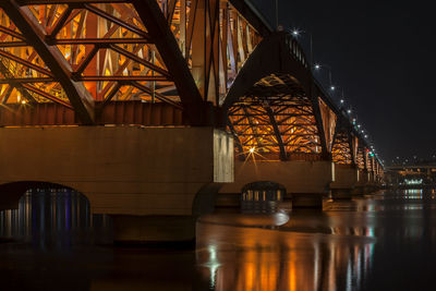 Illuminated seongsan bridge over han river against sky at night