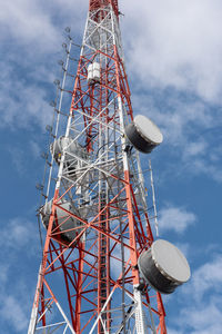 Low angle view of communications tower against sky