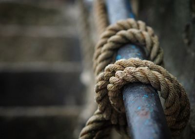 Close-up of rope on metallic railing