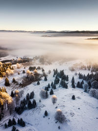 Scenic view of landscape against sky during winter