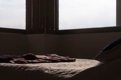 Man relaxing on bed at home