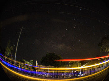 Light trails against sky at night