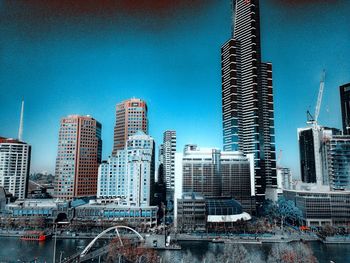 City skyline against blue sky