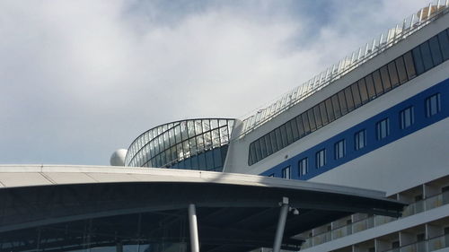 Low angle view of building against cloudy sky