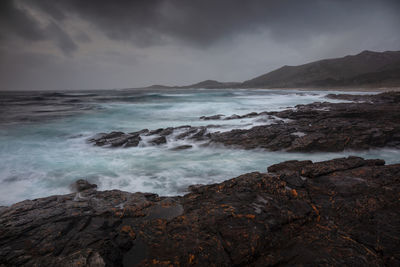 Coastal landscape on a grey and stormy sunset