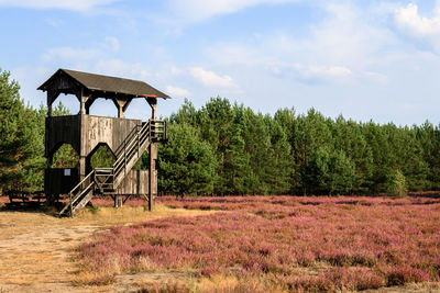 Built structure on field against sky