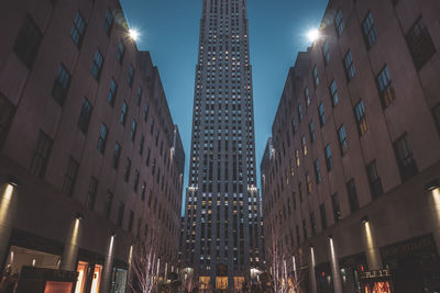 Low angle view of illuminated buildings at night