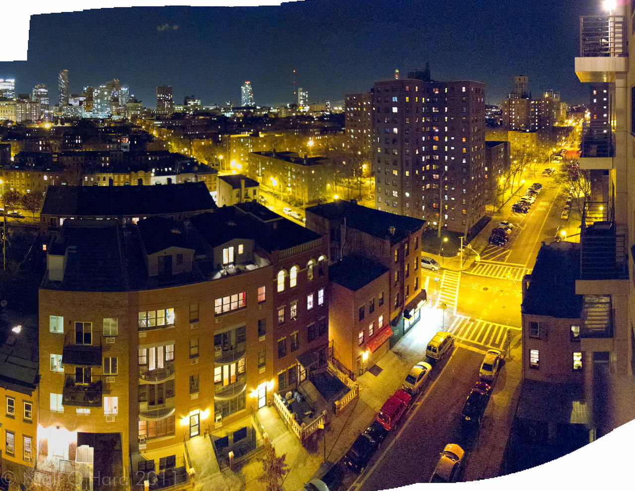 VIEW OF CITY STREET AT NIGHT