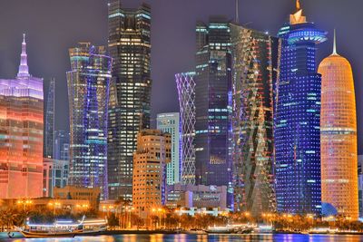 Illuminated buildings in city at night