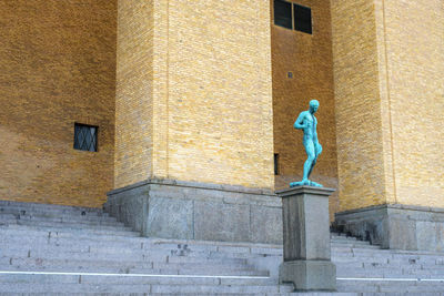 Man statue outside building