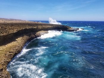 Scenic view of sea against blue sky