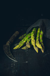 Close-up of vegetables on table against black background