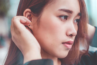 Close-up portrait of young woman