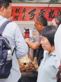 Side view of two people on table