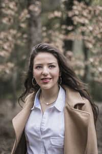 Smiling young woman outdoors