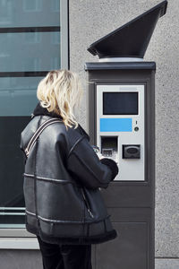 Woman withdrawing money from atm