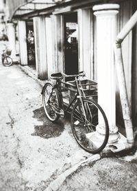Bicycle parked in front of house