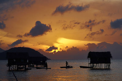 Scenic view of sea against orange sky